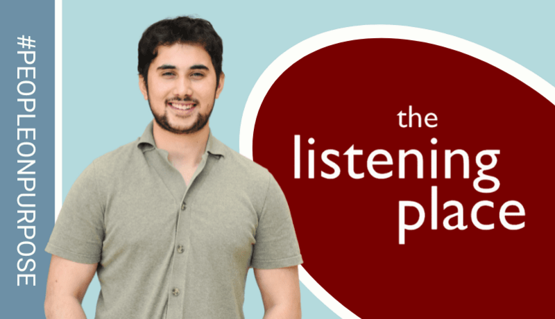 Man in front of the Listening Place logo