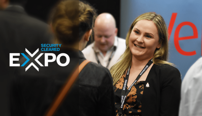 Female recruiter speaks to delegate at Security Cleared EXPO